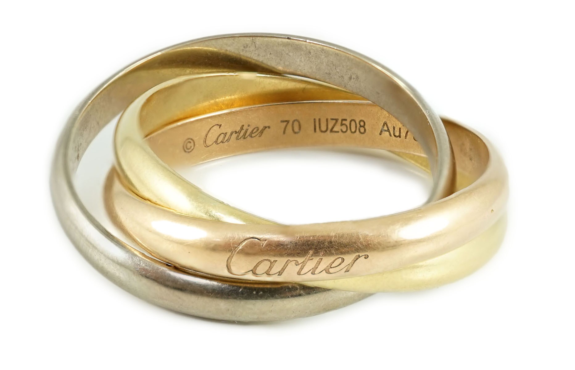 A Cartier triple band three colour 750 yellow metal Trinity Classique ‘’Russian’’ wedding ring, numbered 10Q801